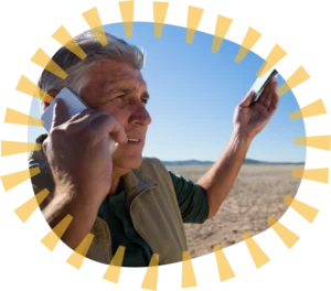 Person speaking on the phone in a rural setting